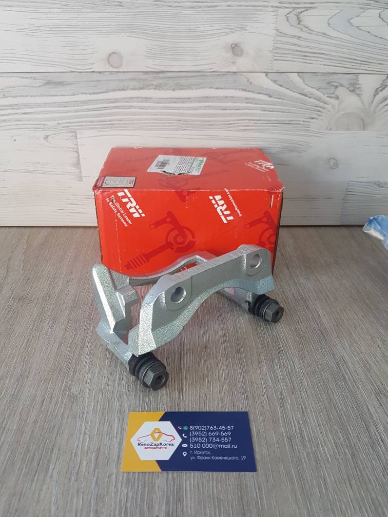 BDA961 TRW Скоба суппорта (Logan - диск вентилир) Правая TRW BDA961 c завода (Германия) ан 7701051905 (ан 7701040965)