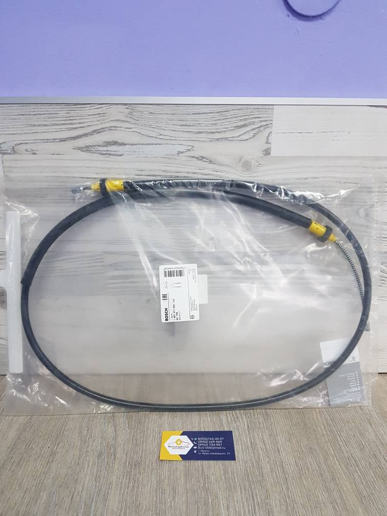 1987477955 Bosch Трос ручного тормоза (Reno Logan , Sandero, Logan с14г) (на 1 колесо) Bosch 1987477955 с завода ан 6001547168